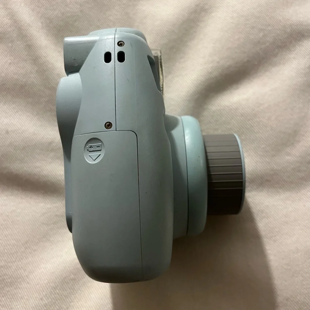 Polaroid camera: Fujifilm, Instax Mini 8. Light blue color, lightly used